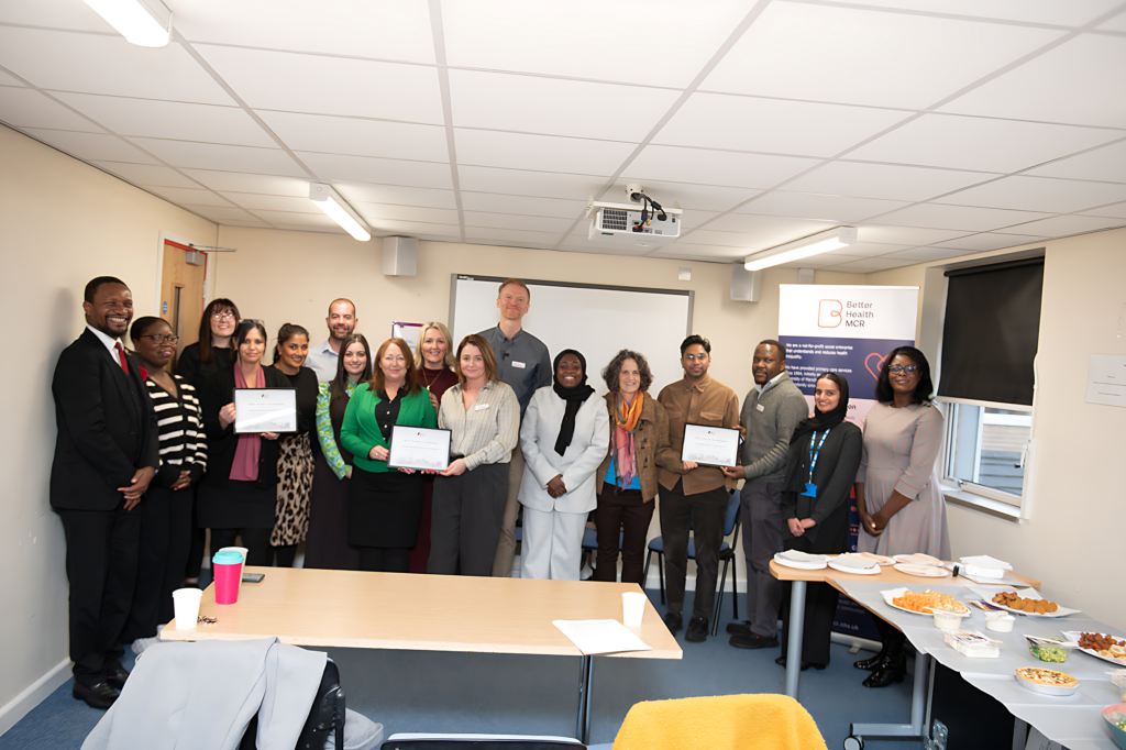 Image of a group of BHM staff with their BHIP silver accreditation certificates